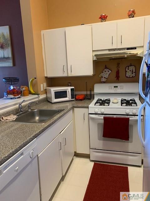 730 Edpas Road New Brunswick, NJ 08901 - Photo 4 of 8 a kitchen with stainless steel appliances granite countertop a stove and a sink