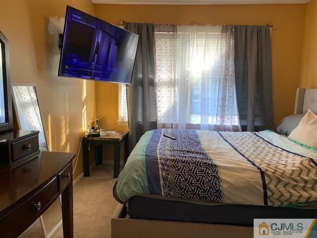 730 Edpas Road New Brunswick, NJ 08901 - Photo 5 of 8 a bedroom with a bed and wooden floor