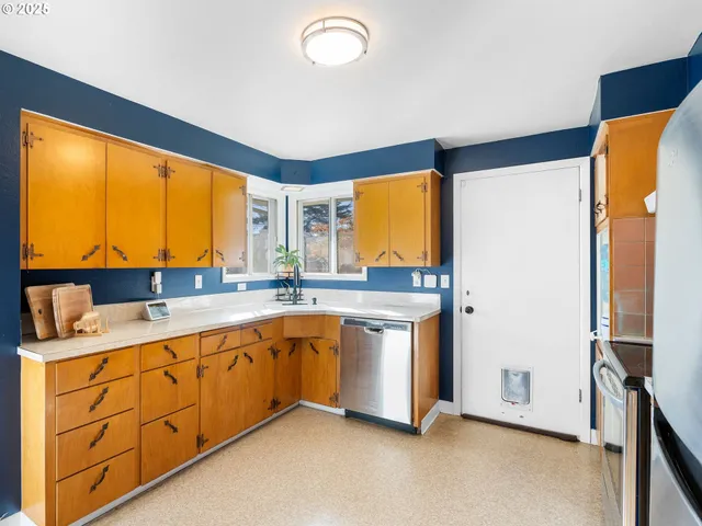 a spacious bathroom with a double vanity sink and a large mirror