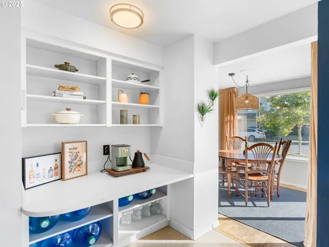 a view of a workspace with furniture and a potted plant