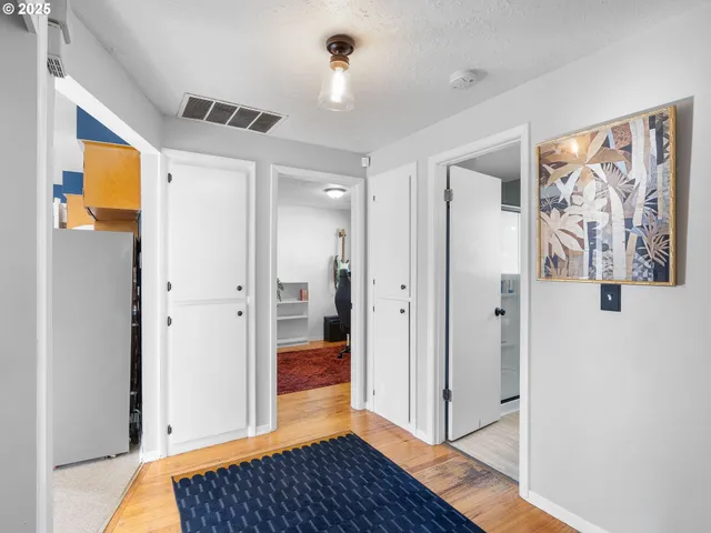 a view of a bathroom with a tub and shower