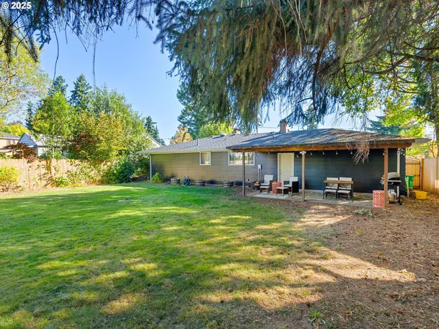 a view of a house with a yard porch and sitting area