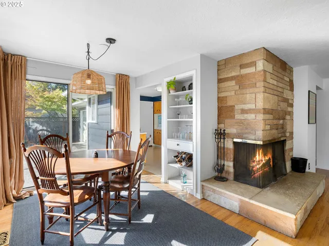 a dining room with furniture and window