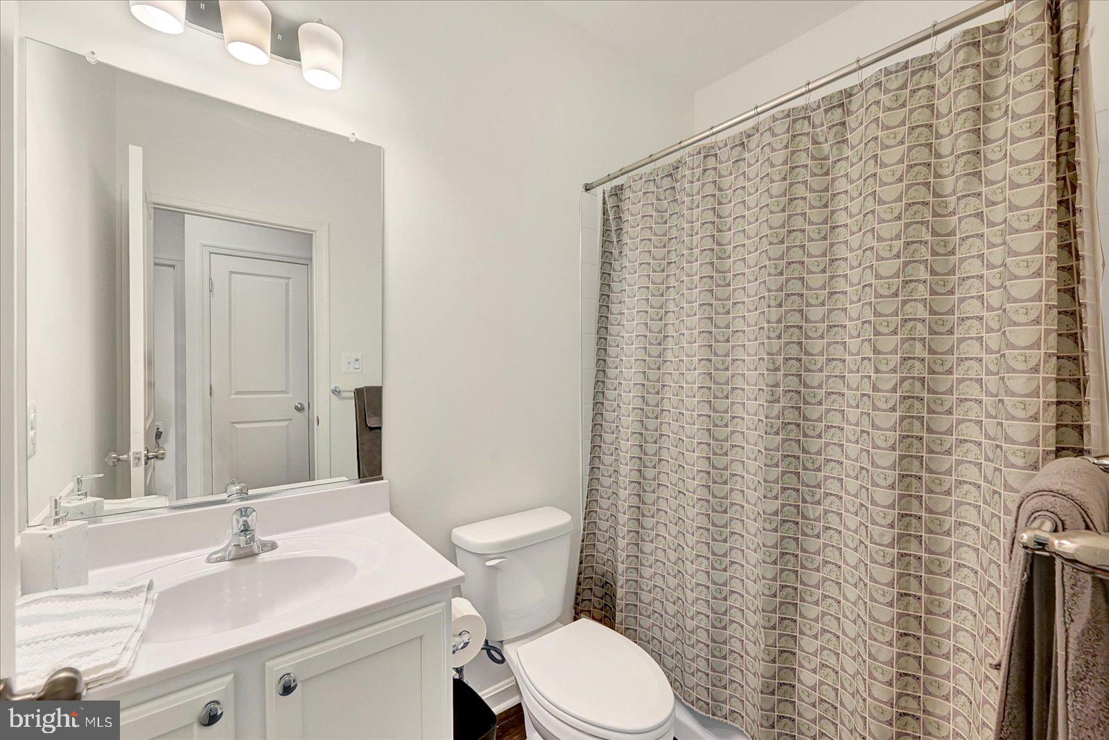 65 Chase Circle Elkton, MD 21921 - Photo 22 of 31 a bathroom with a sink a toilet and a mirror