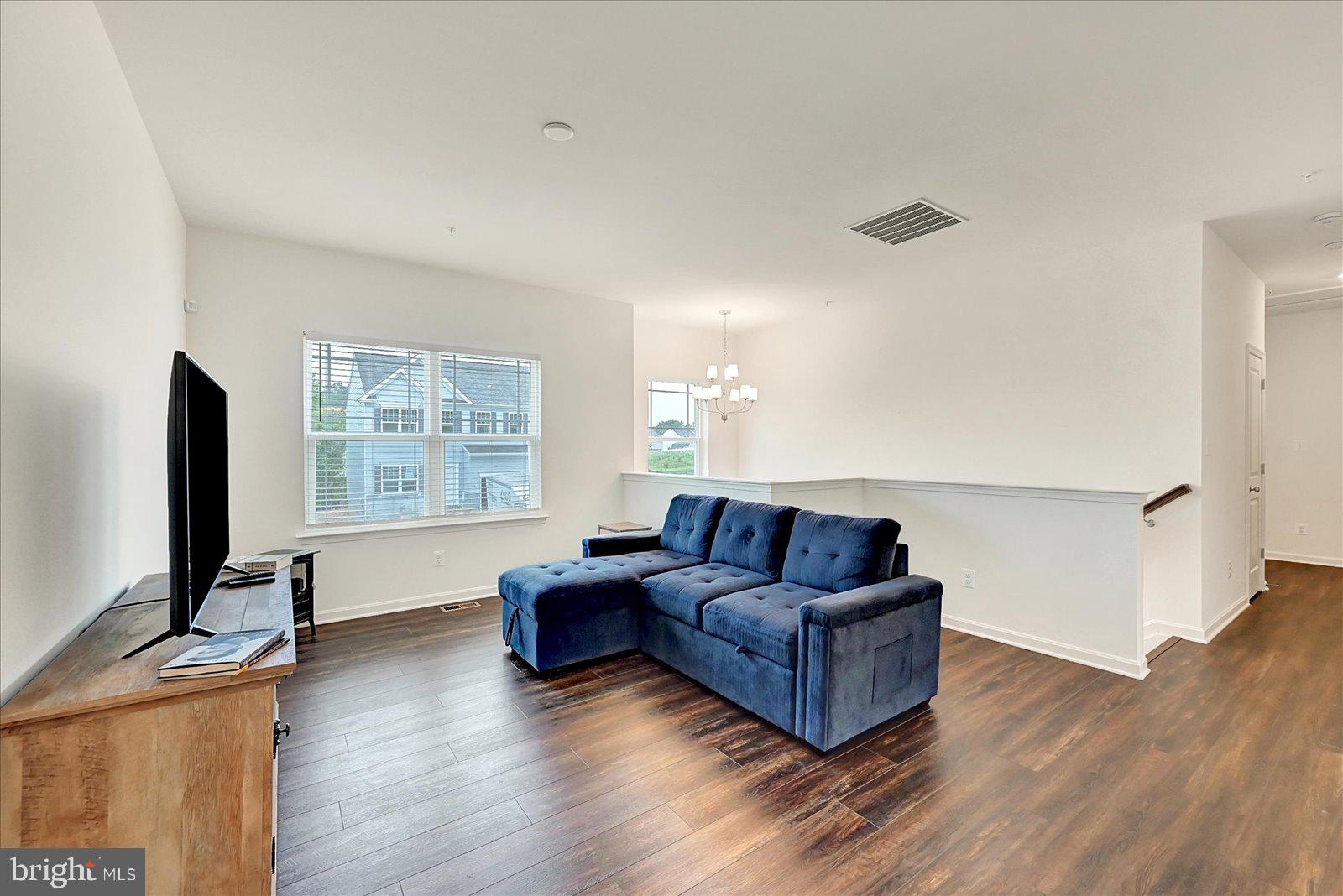 65 Chase Circle Elkton, MD 21921 - Photo 3 of 31 a living room with furniture flat screen tv and wooden floor