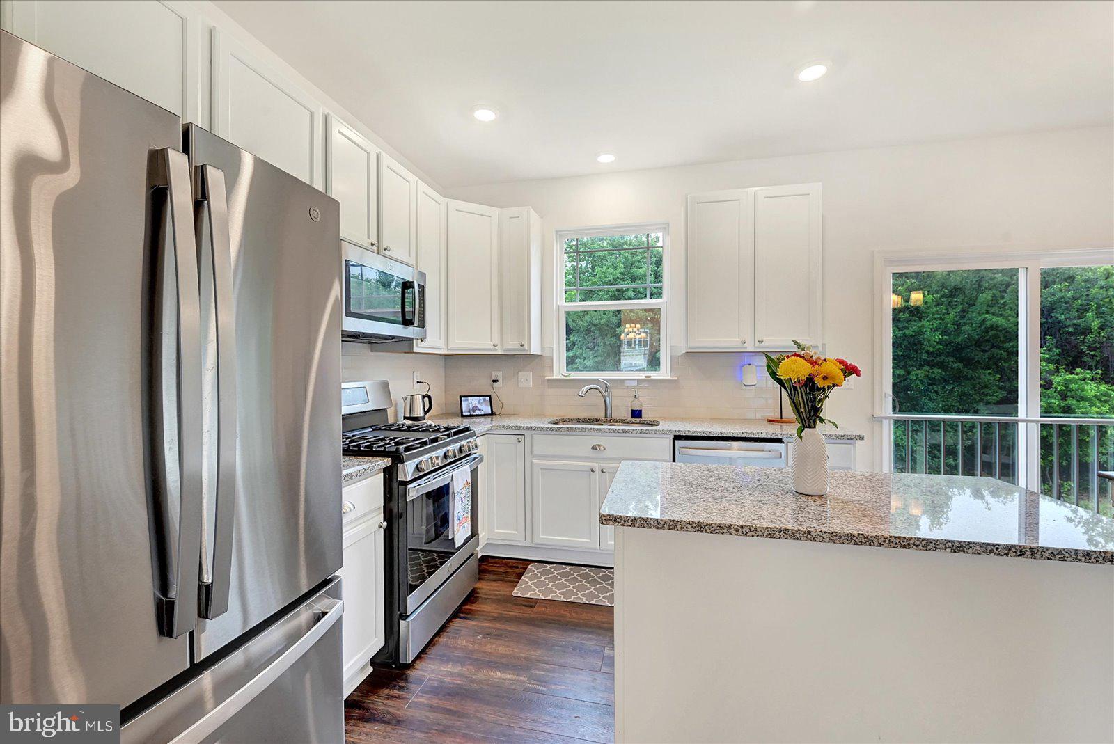 65 Chase Circle Elkton, MD 21921 - Photo 10 of 31 a kitchen with stainless steel appliances granite countertop a refrigerator and a sink