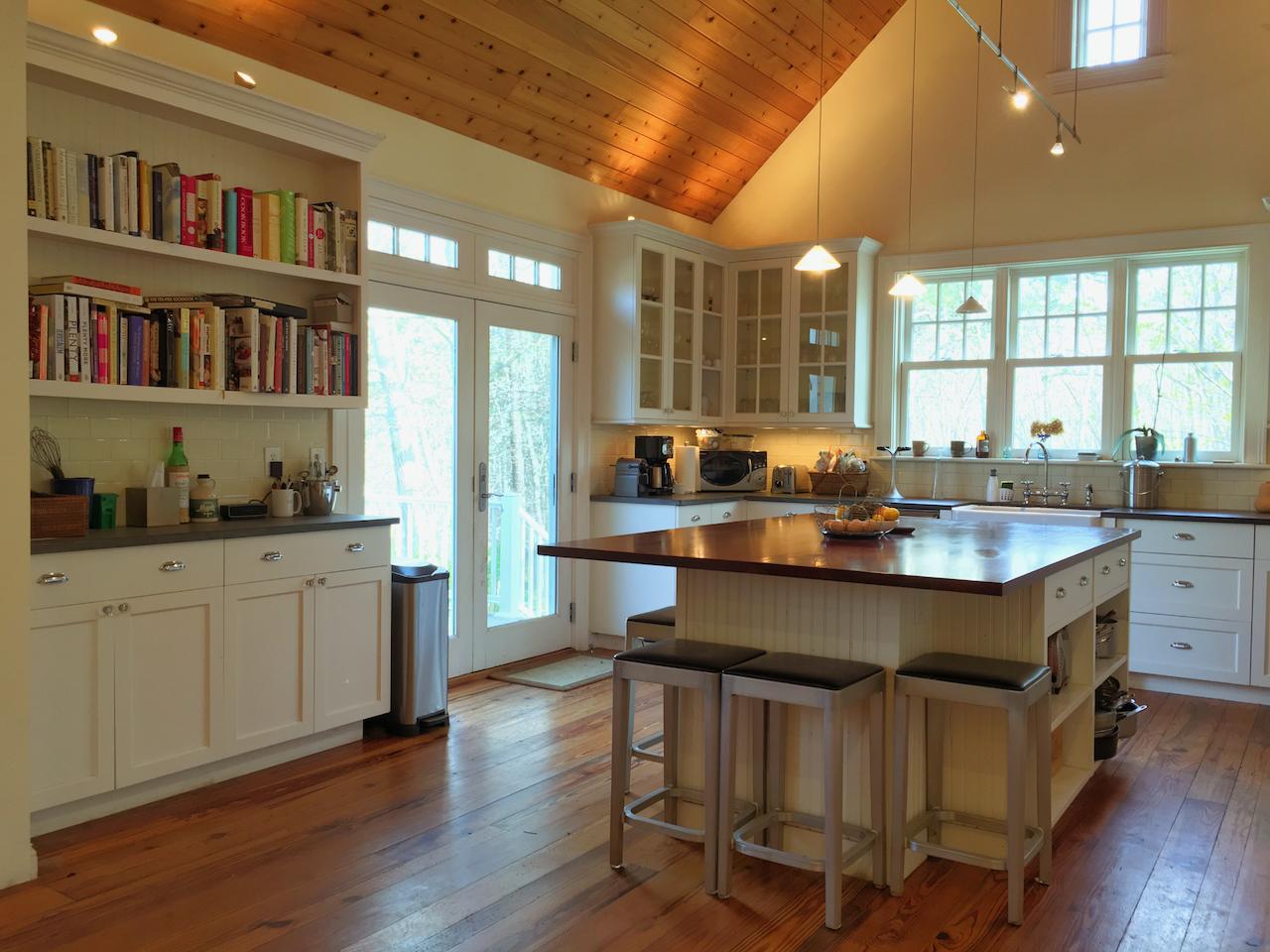 58 Slough Pond Road Truro, MA 02666 - Photo 13 of 30 a kitchen with a sink cabinets and wooden floor