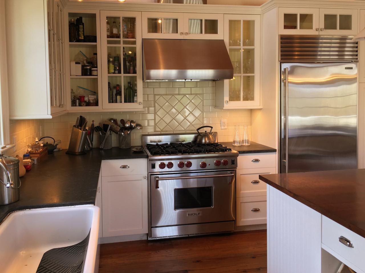 58 Slough Pond Road Truro, MA 02666 - Photo 15 of 30 a kitchen with stainless steel appliances granite countertop a stove and a refrigerator