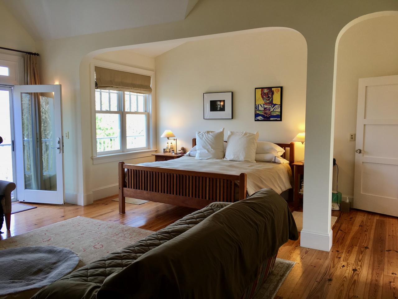 58 Slough Pond Road Truro, MA 02666 - Photo 21 of 30 a bedroom with a bed and wooden floor