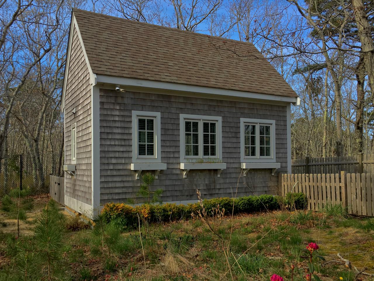 58 Slough Pond Road Truro, MA 02666 - Photo 25 of 30 a front view of a house with a yard