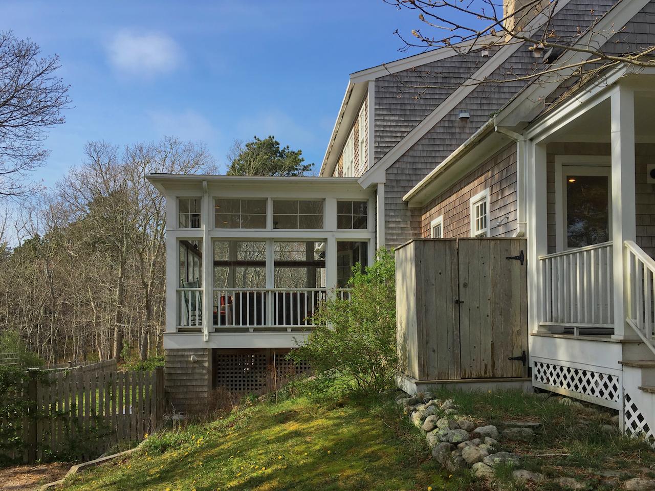 58 Slough Pond Road Truro, MA 02666 - Photo 7 of 30 a front view of a house with a garden