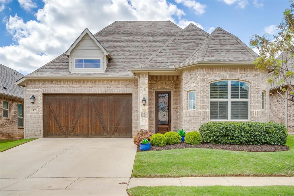 305 Arrowhead Pass Keller, TX 76248 - Photo 1 of 1 a front view of a house with a yard and garage