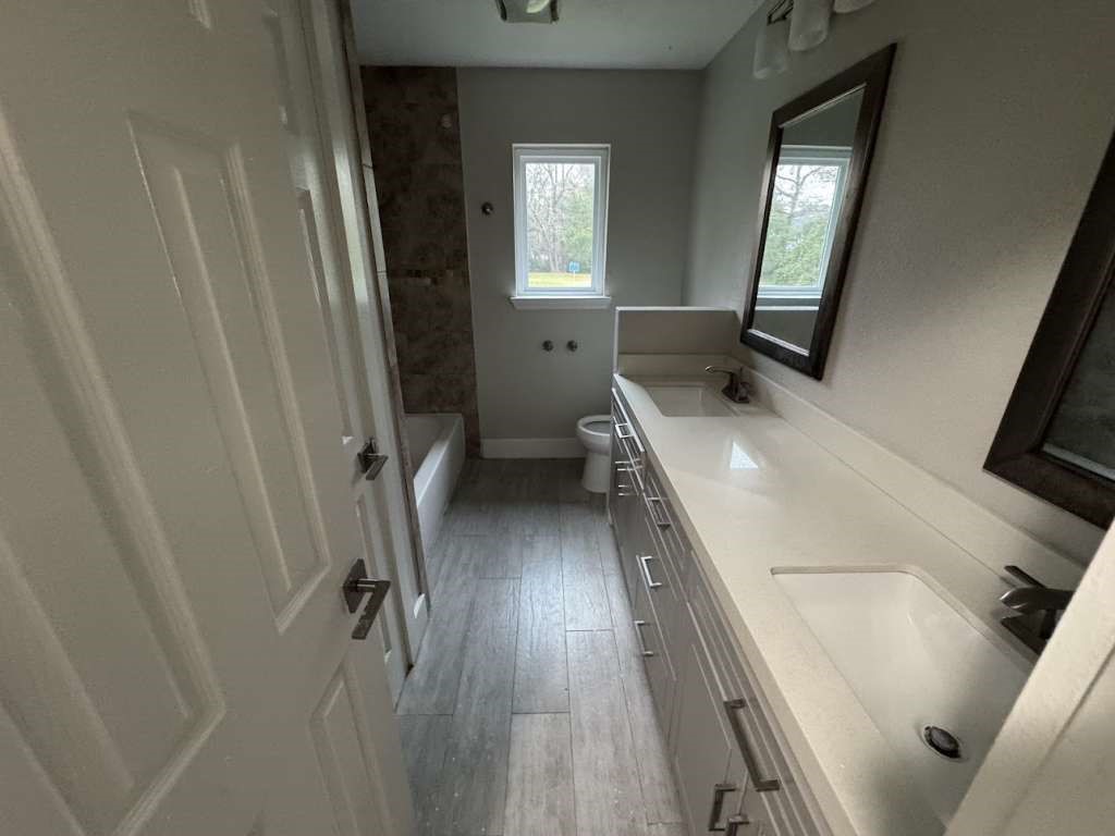 529 Brandon Road Conroe, TX 77302 - Photo 15 of 16 a bathroom with a sink and a large mirror
