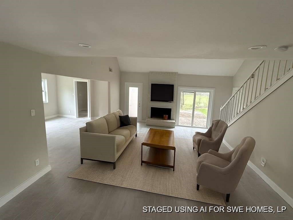 529 Brandon Road Conroe, TX 77302 - Photo 7 of 16 a living room with furniture and a flat screen tv