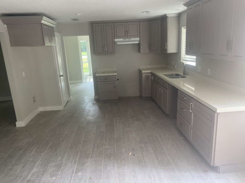 529 Brandon Road Conroe, TX 77302 - Photo 8 of 16 a kitchen with stainless steel appliances a refrigerator and a sink