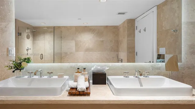 a bathroom with a tub a sink and shower