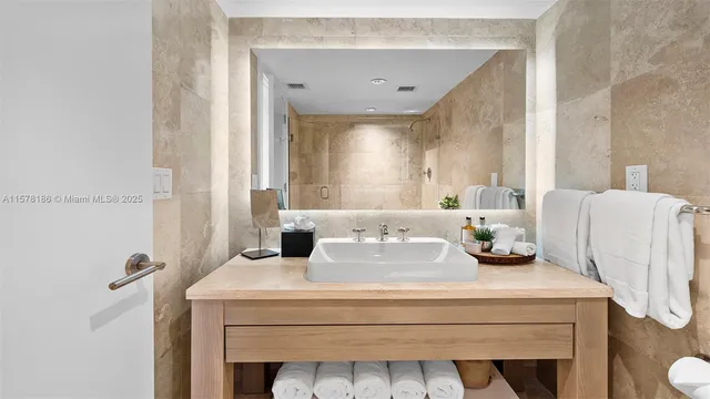 a bathroom with a shower toilet and sink