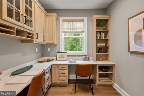 a kitchen that has a sink a stove and a table in it