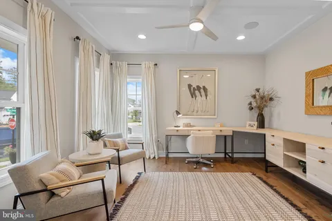 a workspace with furniture and window