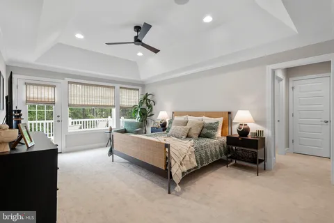 a spacious bedroom with a bed and a large window