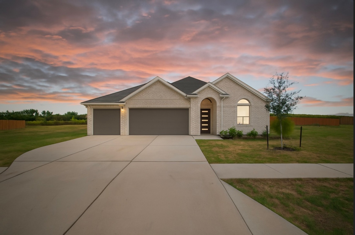 front view of a house with a yard