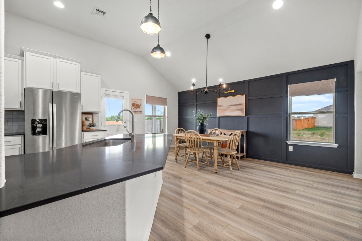 352 Backstays Loop Kyle, TX 78640 - Photo 11 of 39 a view of a dining room with furniture window and wooden floor