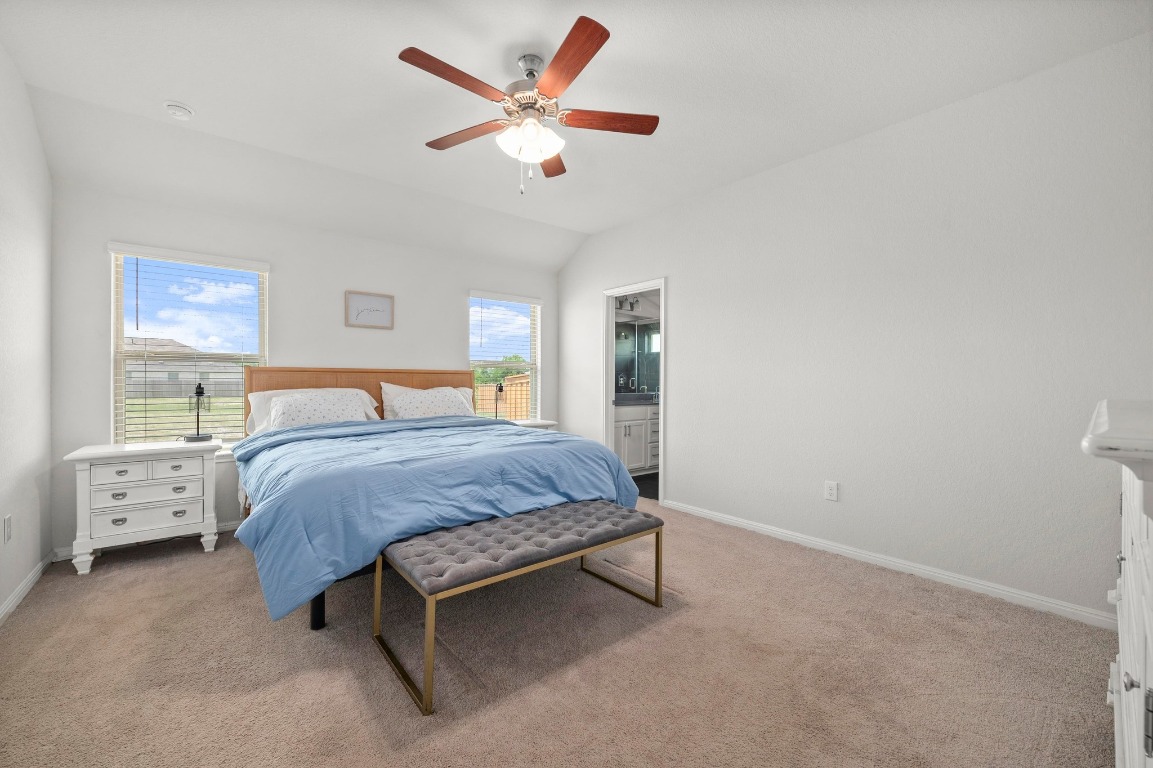 352 Backstays Loop Kyle, TX 78640 - Photo 16 of 39 a bedroom with a bed and a ceiling fan