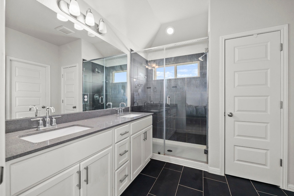 352 Backstays Loop Kyle, TX 78640 - Photo 19 of 39 a bathroom with a shower sink and mirror