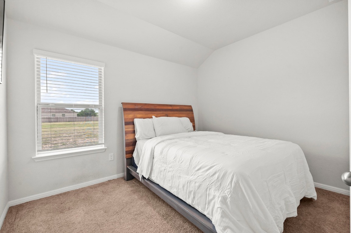 352 Backstays Loop Kyle, TX 78640 - Photo 23 of 39 a bedroom with a bed and a window
