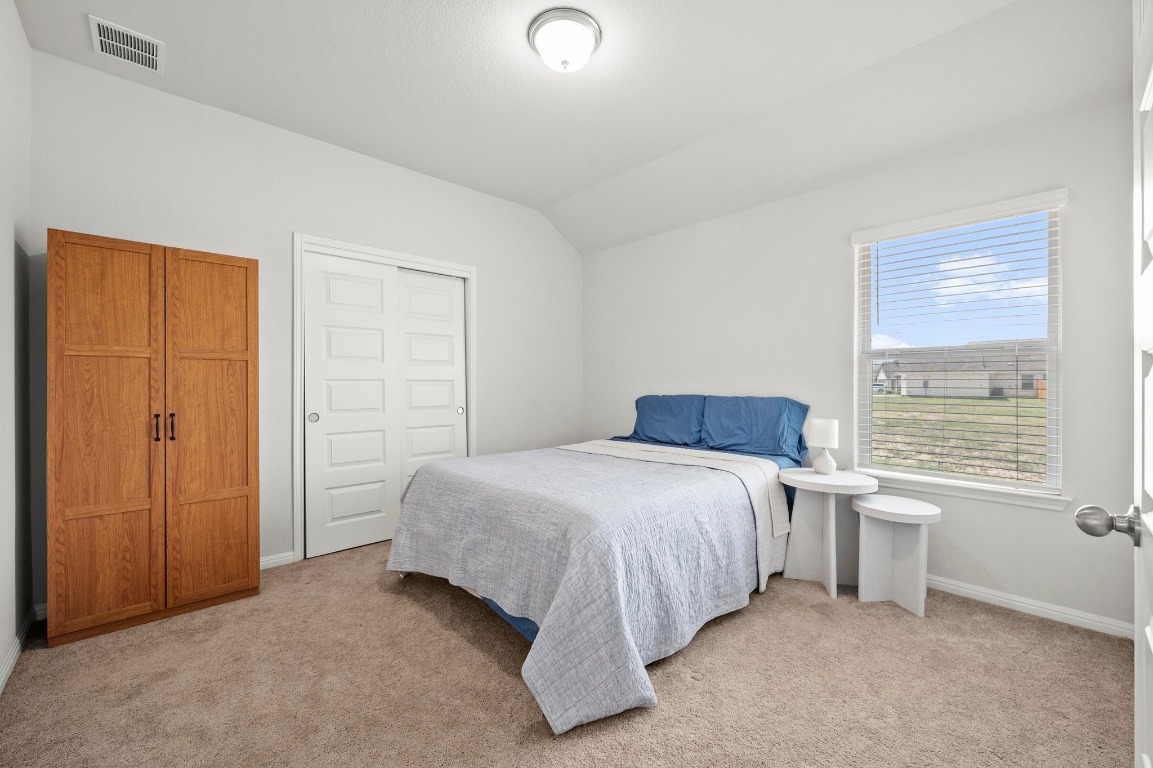 352 Backstays Loop Kyle, TX 78640 - Photo 24 of 39 a bedroom with a bed and a window