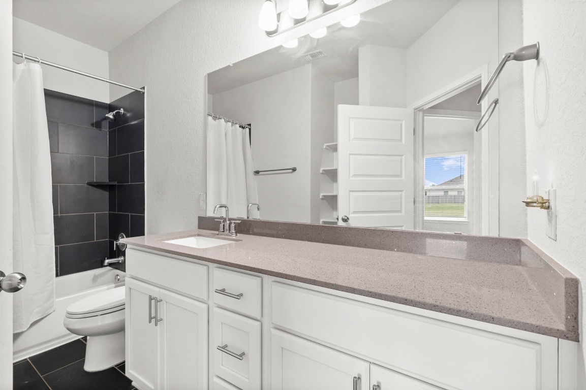 352 Backstays Loop Kyle, TX 78640 - Photo 25 of 39 a bathroom with a sink a toilet and a shower