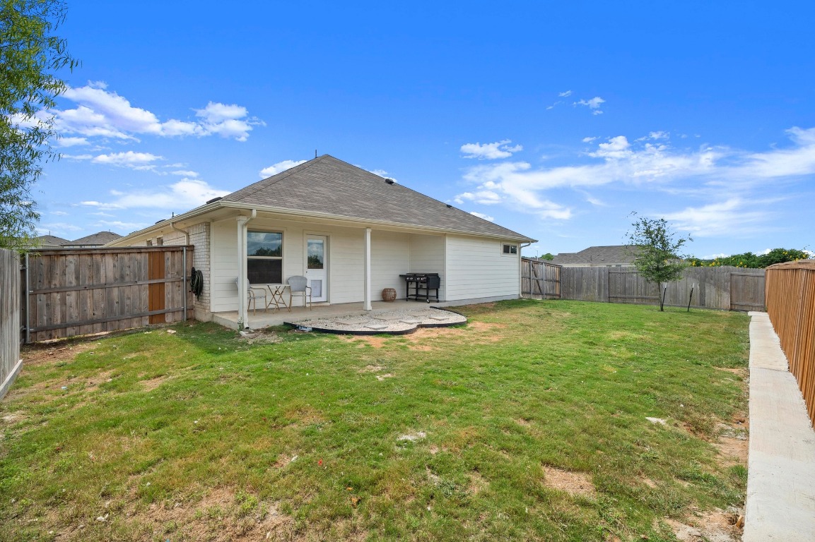 352 Backstays Loop Kyle, TX 78640 - Photo 27 of 39 a backyard of a house with table and chairs