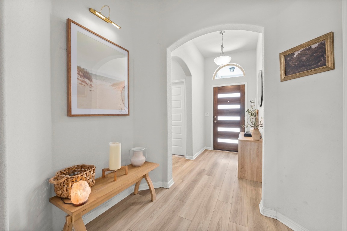 352 Backstays Loop Kyle, TX 78640 - Photo 3 of 39 a living room with furniture and a wooden floor