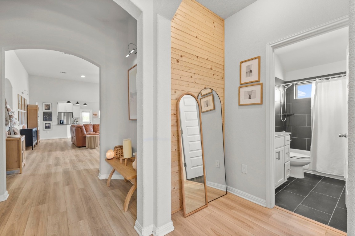 352 Backstays Loop Kyle, TX 78640 - Photo 4 of 39 a living room with furniture a wooden floor and a glass door
