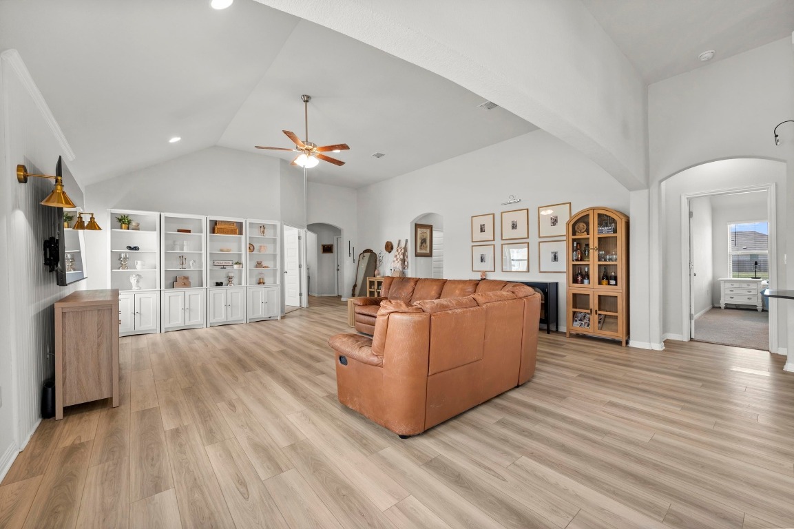 352 Backstays Loop Kyle, TX 78640 - Photo 8 of 39 a living room with furniture a flat screen tv and a wooden floor
