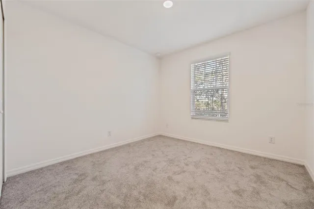 a bathroom with a double vanity sink mirror and toilet