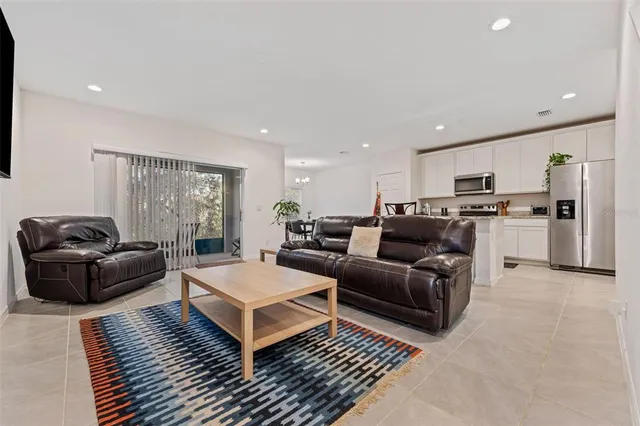 a living room with furniture and a rug