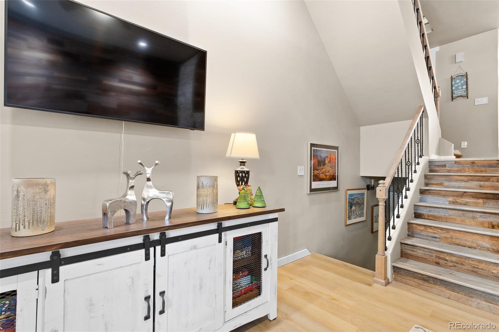 200 Primrose Path, Unit 11 Breckenridge, CO 80424 - Photo 11 of 32 a kitchen with stainless steel appliances a sink a stove and a flat screen tv