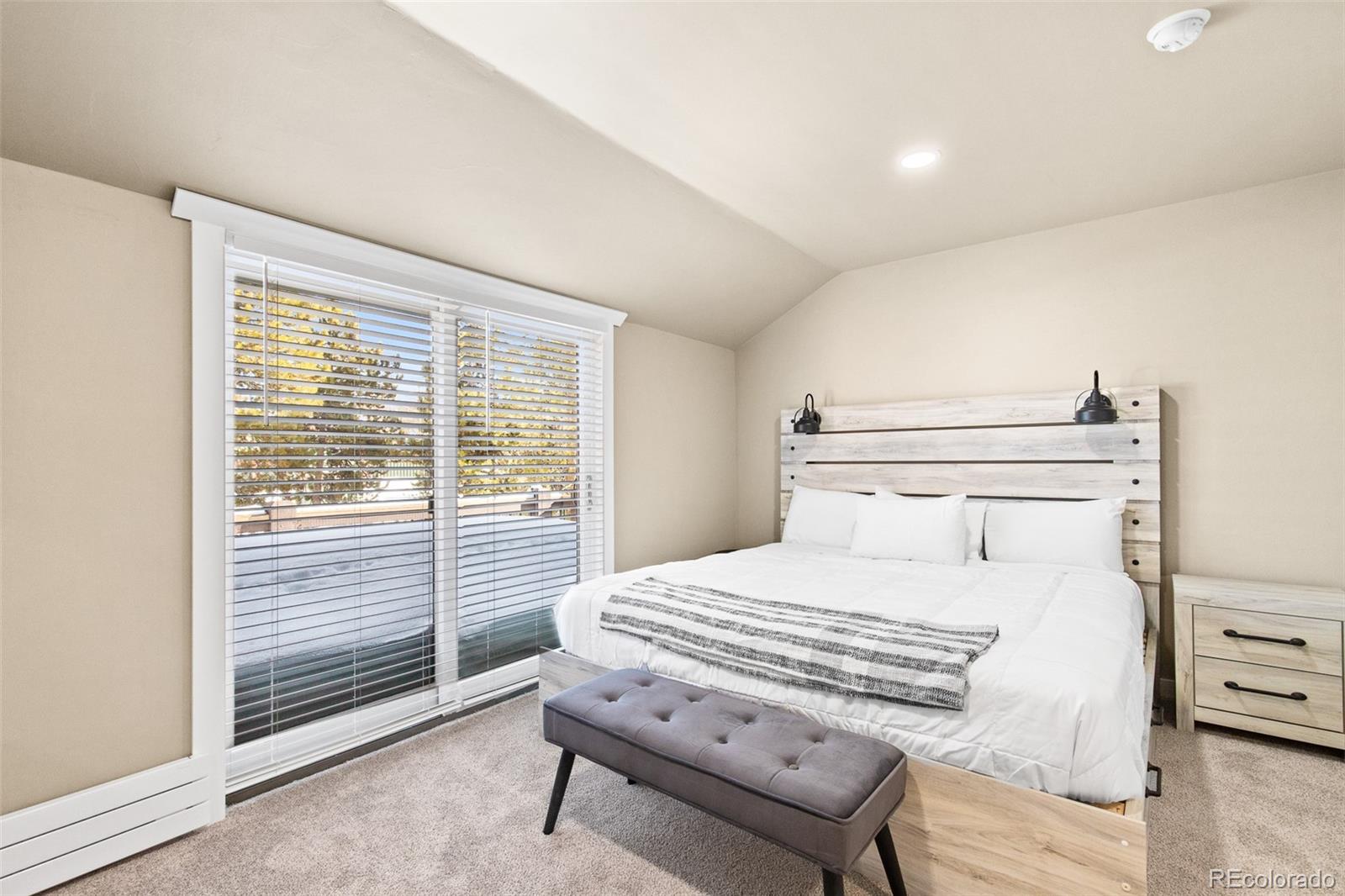 200 Primrose Path, Unit 11 Breckenridge, CO 80424 - Photo 12 of 32 a bedroom with a bed and a tv