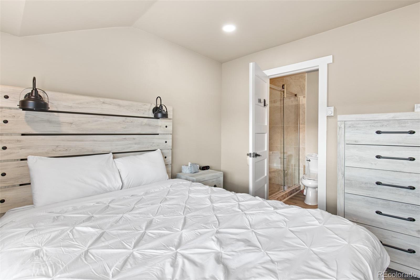 200 Primrose Path, Unit 11 Breckenridge, CO 80424 - Photo 18 of 32 a bedroom with a bed and a closet