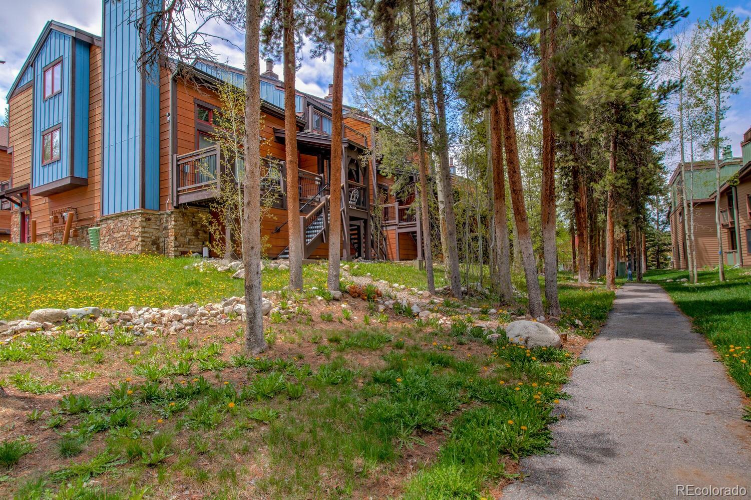 200 Primrose Path, Unit 11 Breckenridge, CO 80424 - Photo 20 of 32 a view of a building with a yard