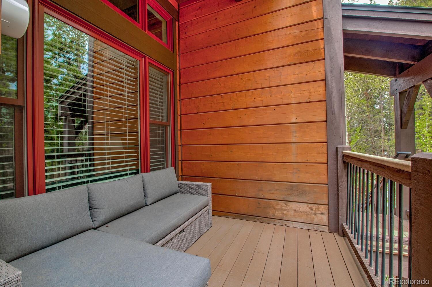 200 Primrose Path, Unit 11 Breckenridge, CO 80424 - Photo 23 of 32 a view of a balcony with wooden floor and iron stairs