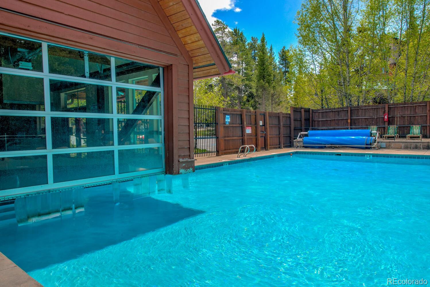 200 Primrose Path, Unit 11 Breckenridge, CO 80424 - Photo 28 of 32 a view of a deck with a big yard and large trees