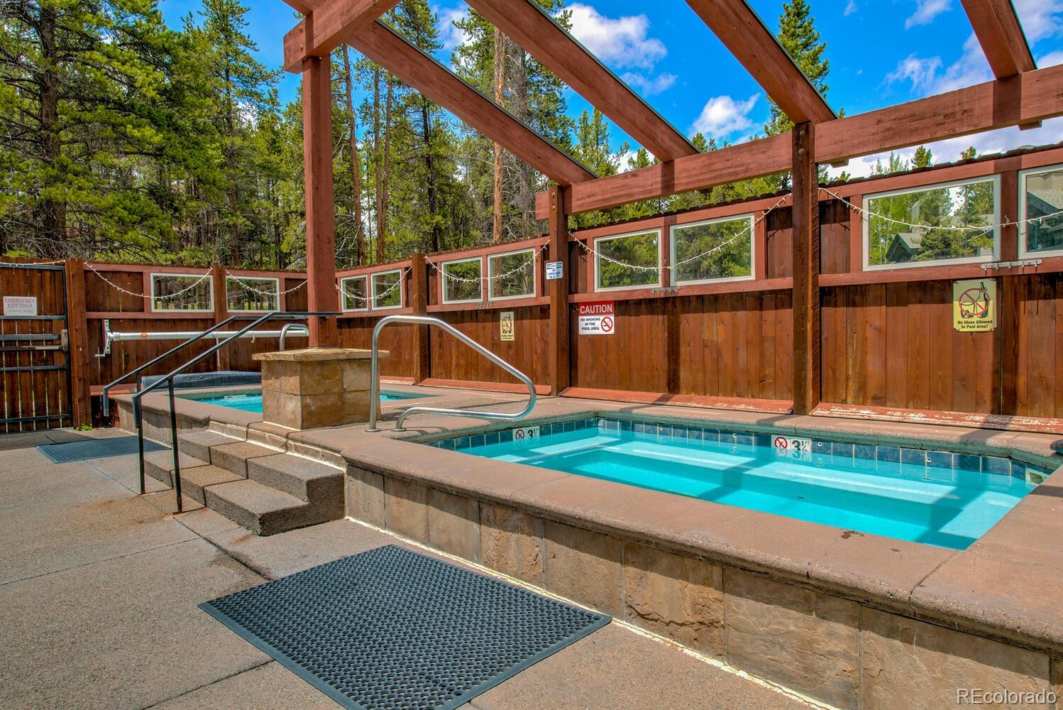 200 Primrose Path, Unit 11 Breckenridge, CO 80424 - Photo 29 of 32 a view of backyard with deck and seating area