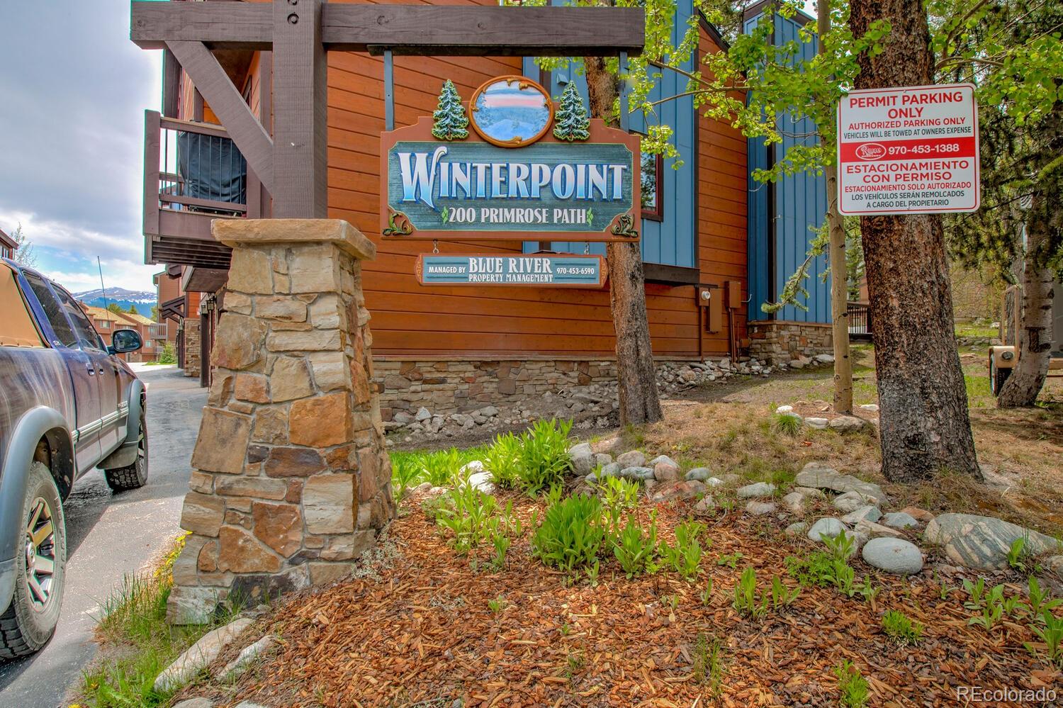 200 Primrose Path, Unit 11 Breckenridge, CO 80424 - Photo 4 of 32 a sign on the side of a road