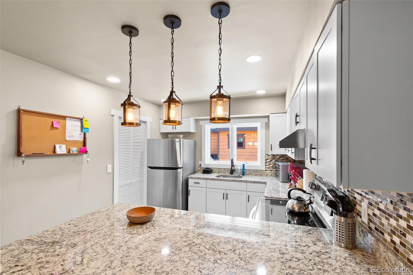 200 Primrose Path, Unit 11 Breckenridge, CO 80424 - Photo 9 of 32 a kitchen with refrigerator and stove