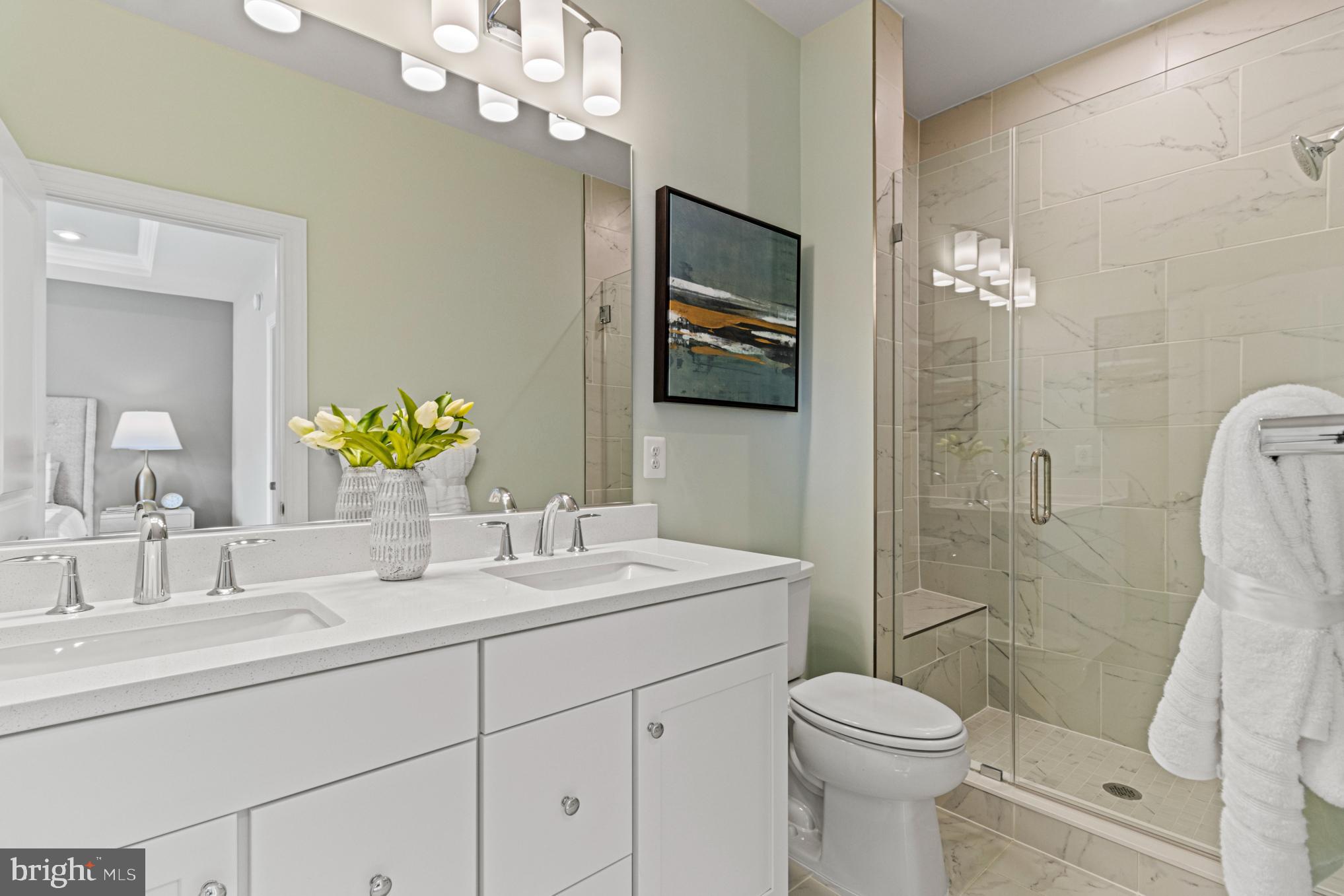12504 Terrabrooke Avenue Brandywine, MD 20613 - Photo 12 of 34 a bathroom with a sink a toilet and shower