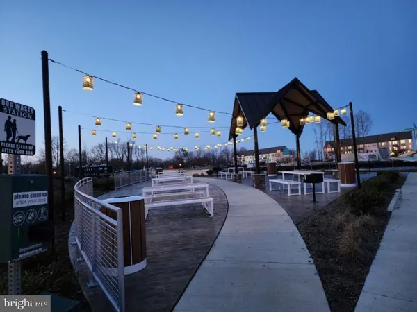 a front view of a building with a garden