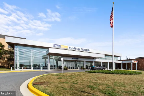 a view of a building with sitting area