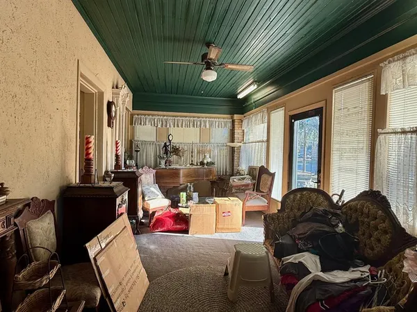 a view of a livingroom with furniture hardwood floor and a chandelier